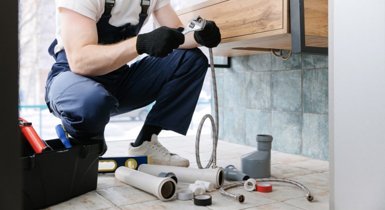 plumbing contractor completing a repair